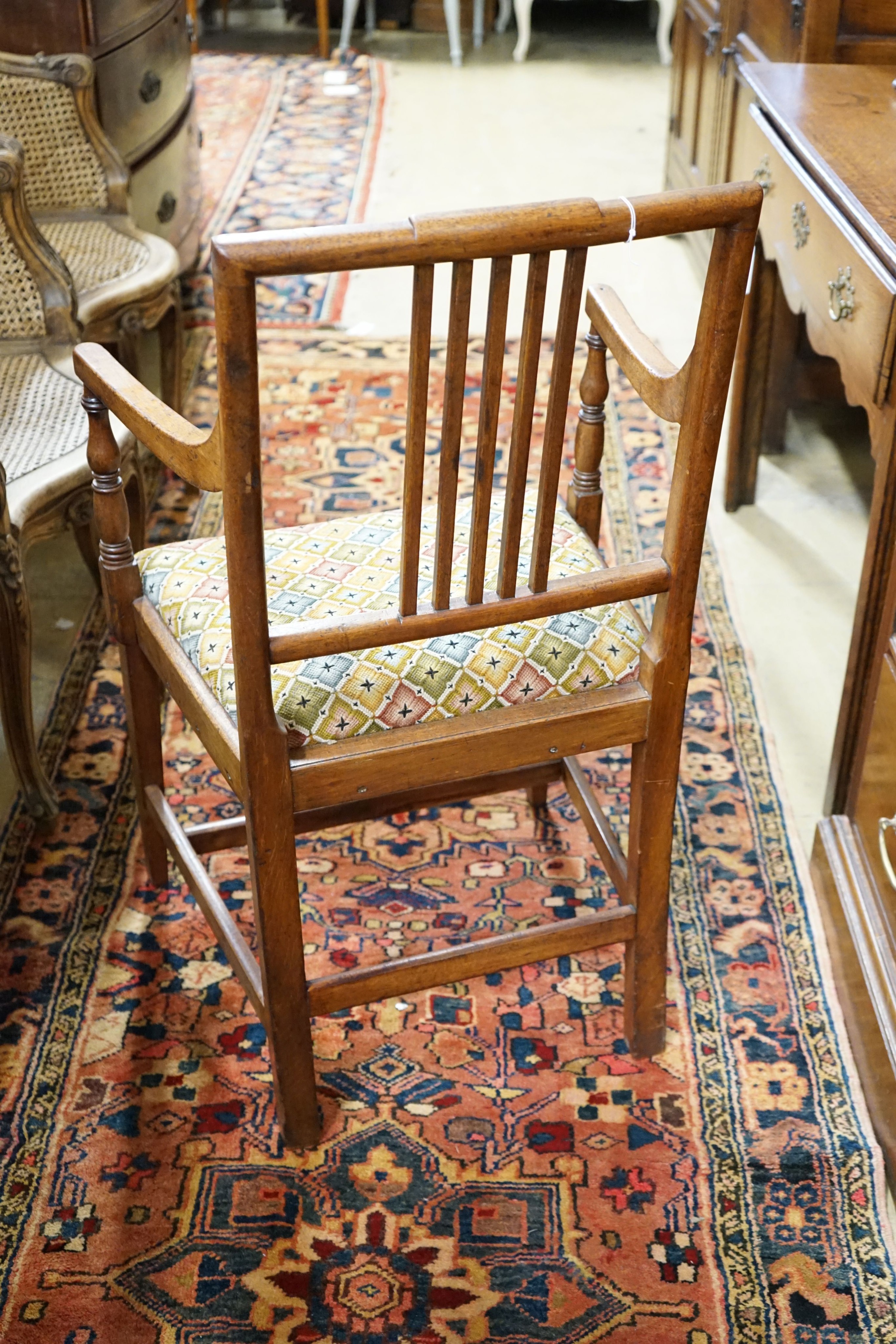 A Regency mahogany elbow chair and three others